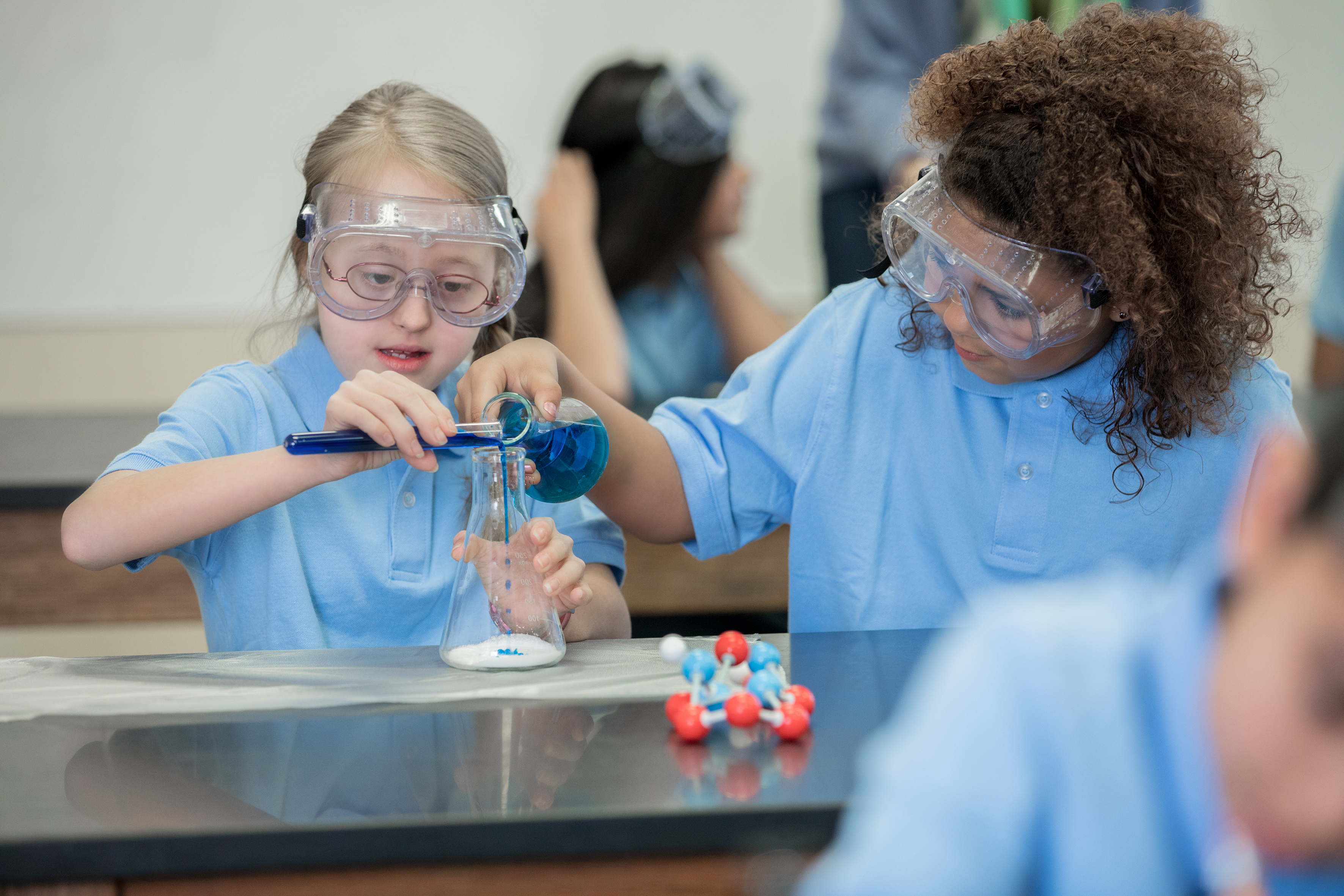 Students taking part in chemistry experiment