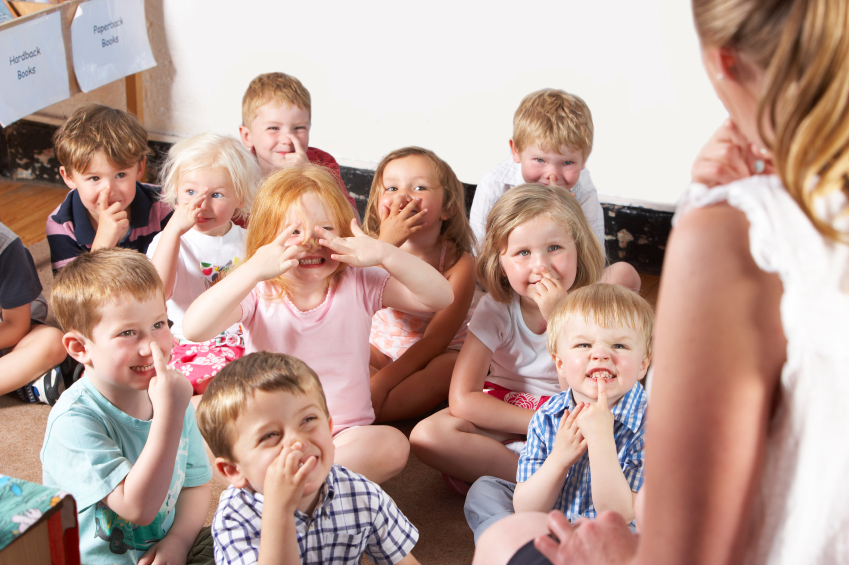 headteacher talking to children in an assembly fashion