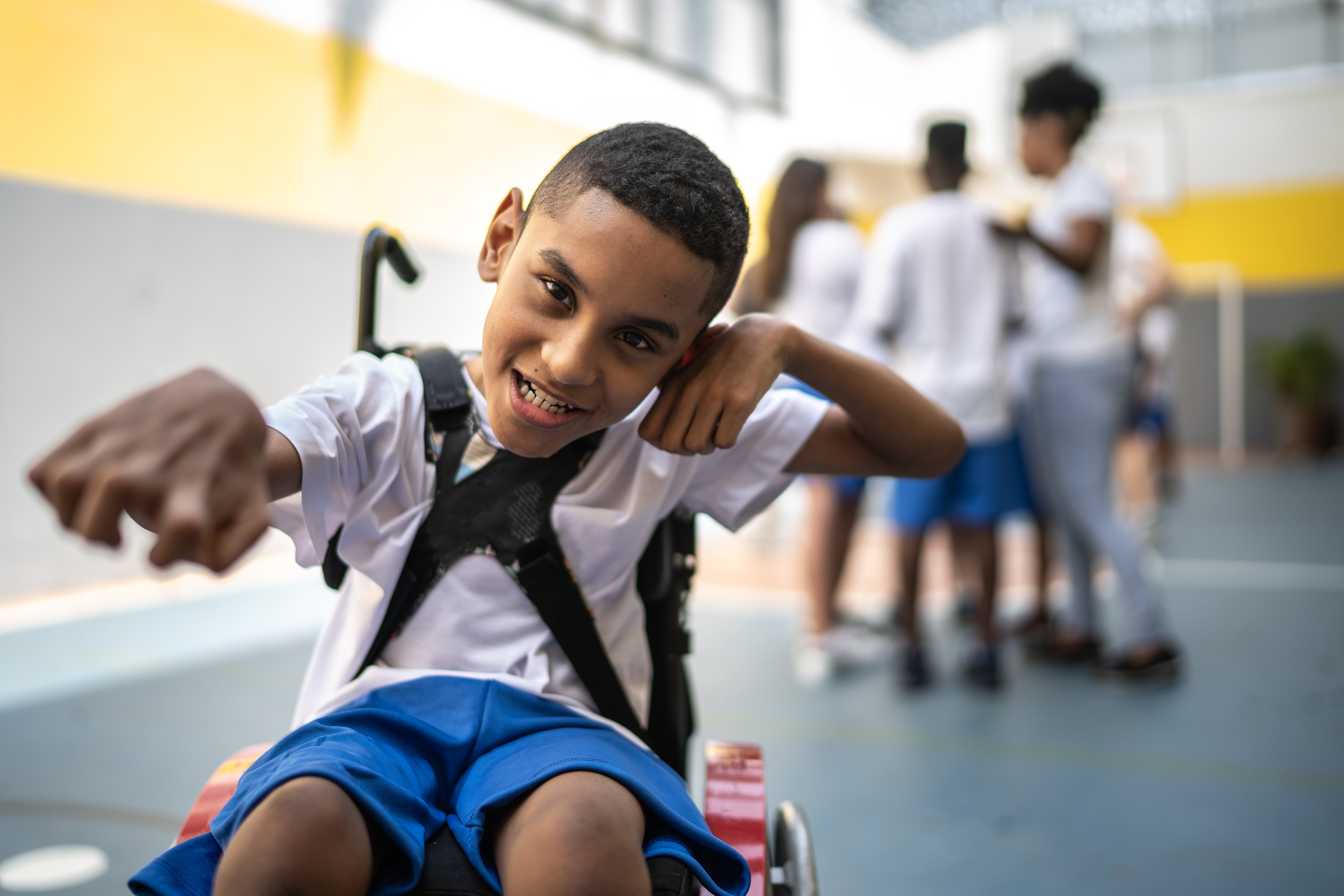 Young student in a wheelchair on the sports court